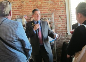 Tony Howard, President and CEO of the Loudoun Chamber of Commerce, welcomes business leaders and new members to Catoctin Creek Distillery for the Chamber's After Hours Mixer. Photo by Gazette.